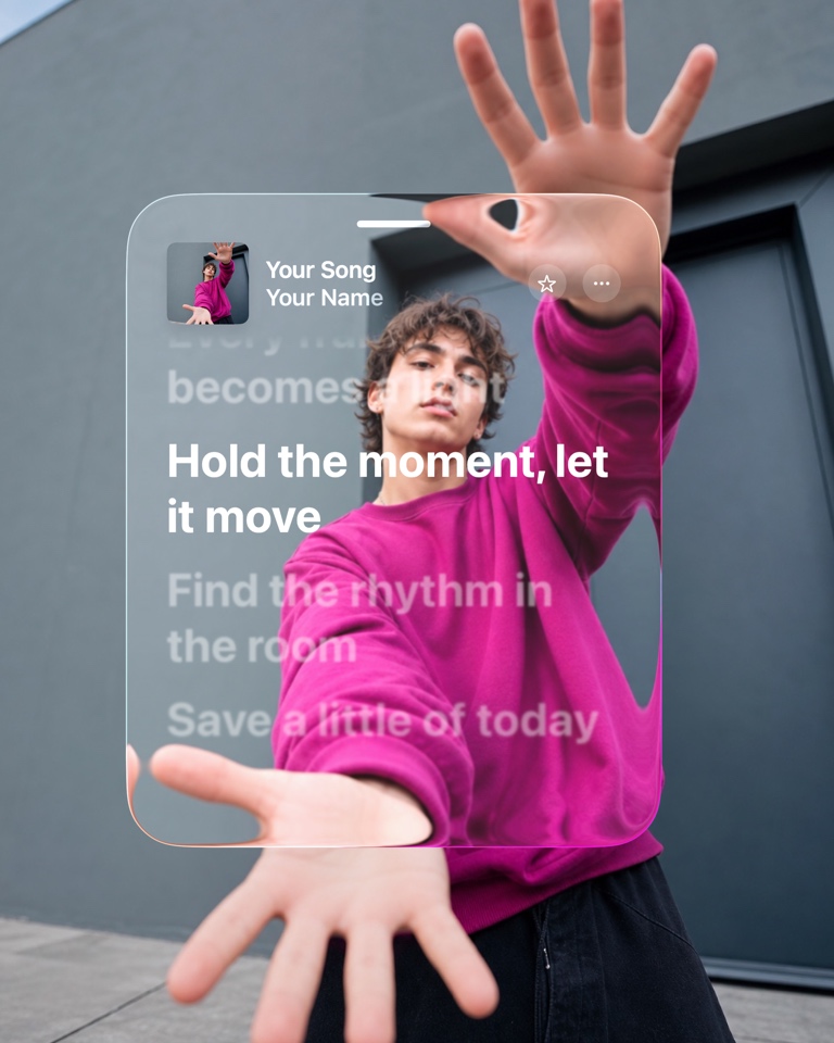 A glass lyrics card refracting a vivid magenta portrait.